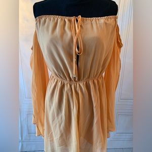 light airy peach romper for a night out. Has never been worn.